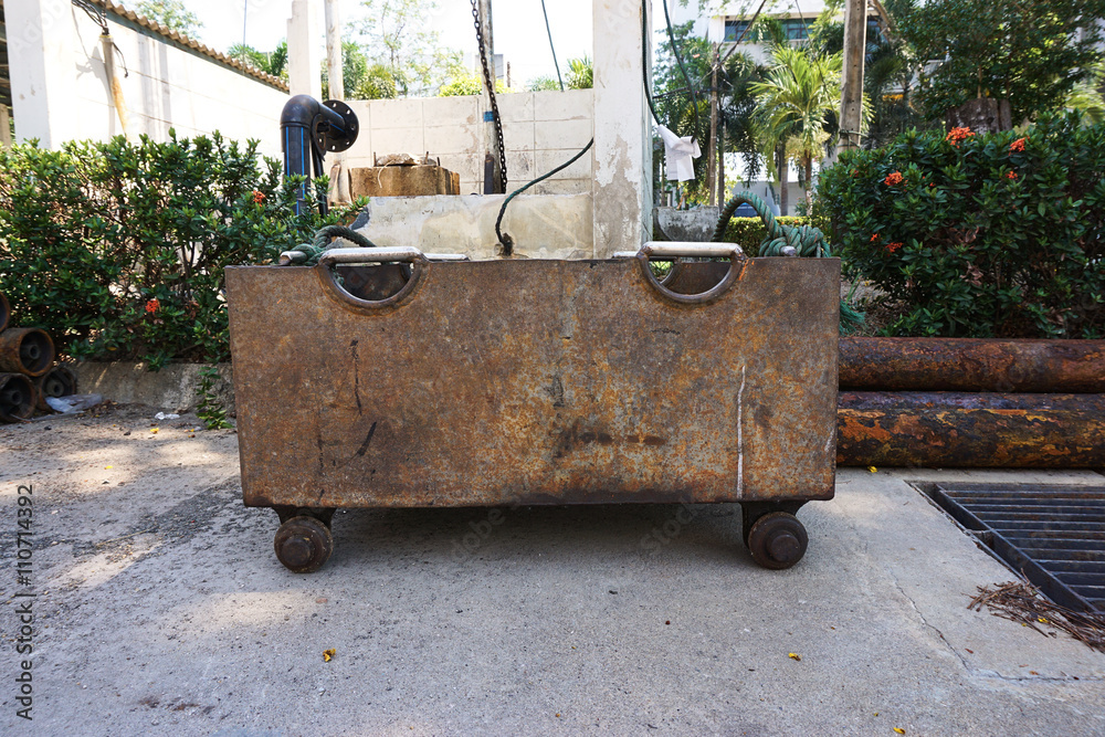 A rusty handcart for pickup construction materials