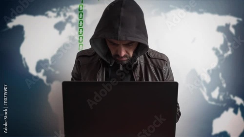 Bearded hacker in a hood with laptop. Online world network danger.