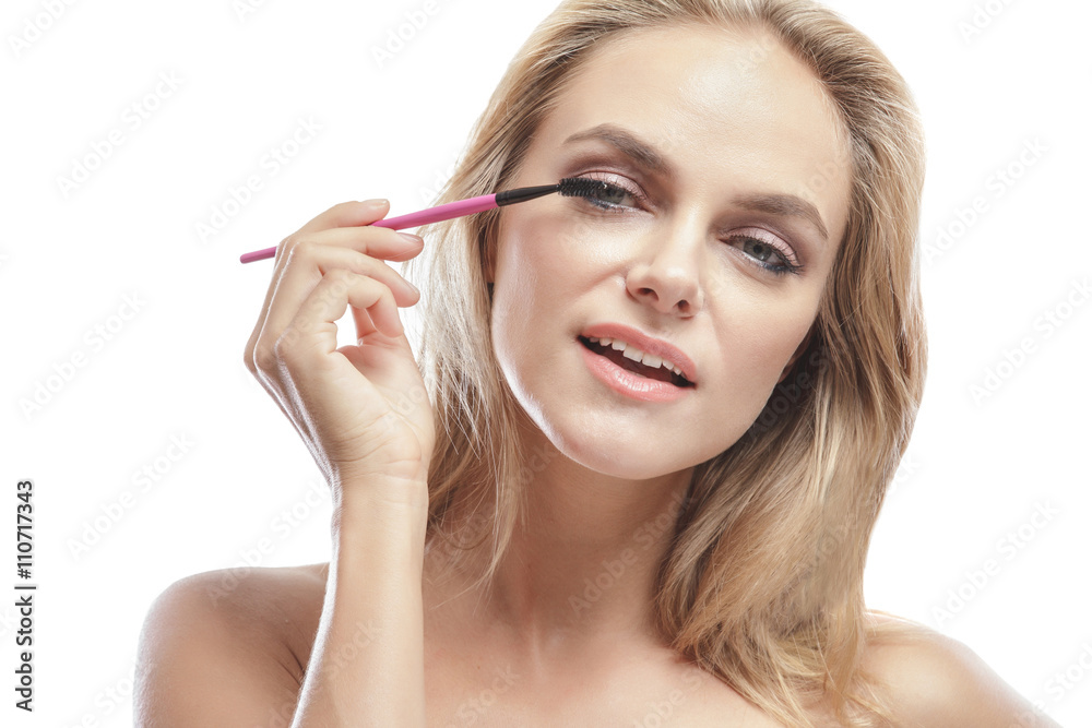 beautiful young blonde woman applying mascara beautiful young blonde woman applying mascara