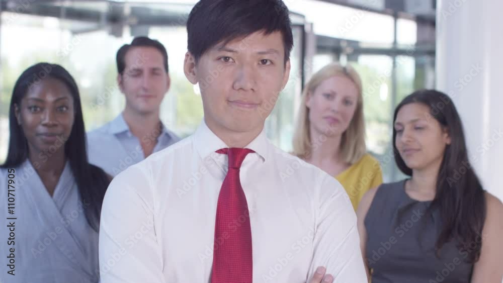 Portrait of cheerful smiling business team in modern office building Portrait of cheerful smiling business team in modern office building