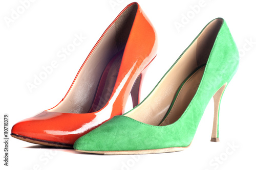 bright, multicolored female shoes on high heels isolated on white background