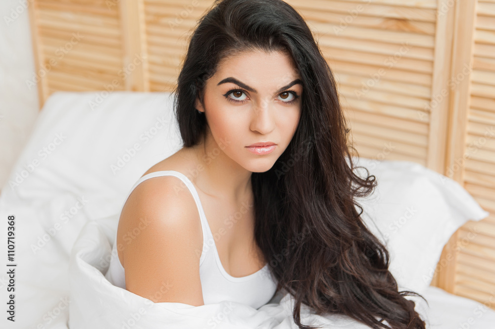 Portrait of serious brunette in the morning, looking up Portrait of serious brunette in the morning, looking up