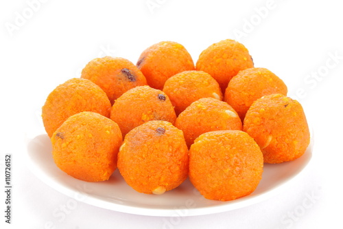 Plate of tasty Red  Diwali sweets  Ladoo or bundi laddu in leaf. photo