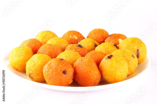  Red and yelow Diwali sweets  Ladoo or bundi laddu in plate photo