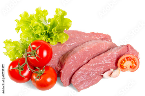 Chunks fresh beef, lettuce and tomatoes isolated on white background.