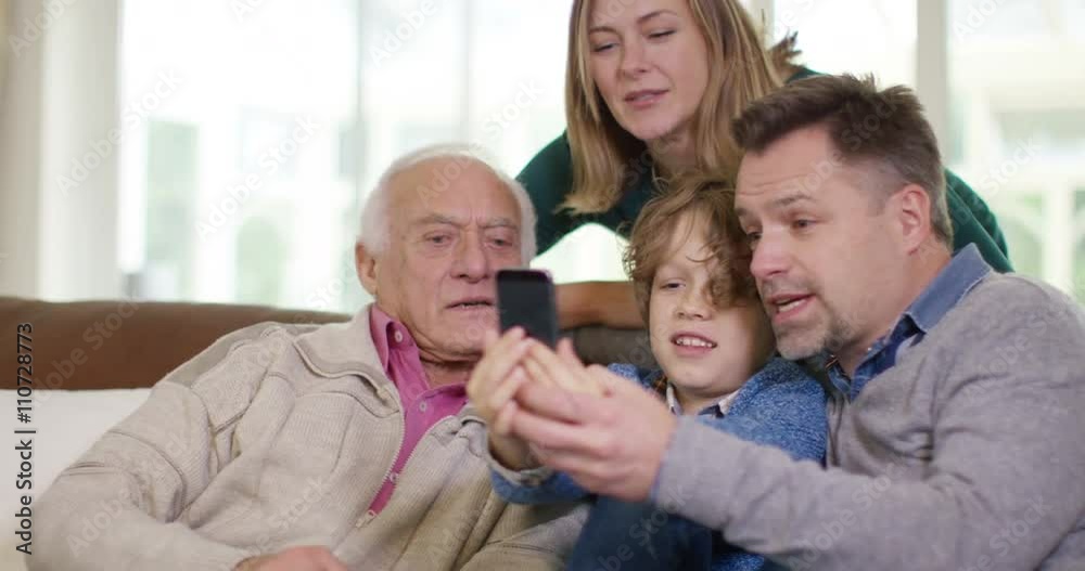 Family generations - 3 generations of family pose for selfie with camera phon Family generations - 3 generations of family pose for selfie with camera phon