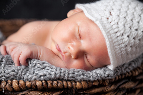 Beautiful newborn inside a basket