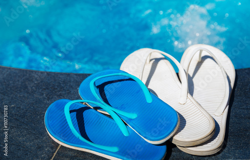 Blue slippers near swimming pool - holiday concept © AnnaMoskvina