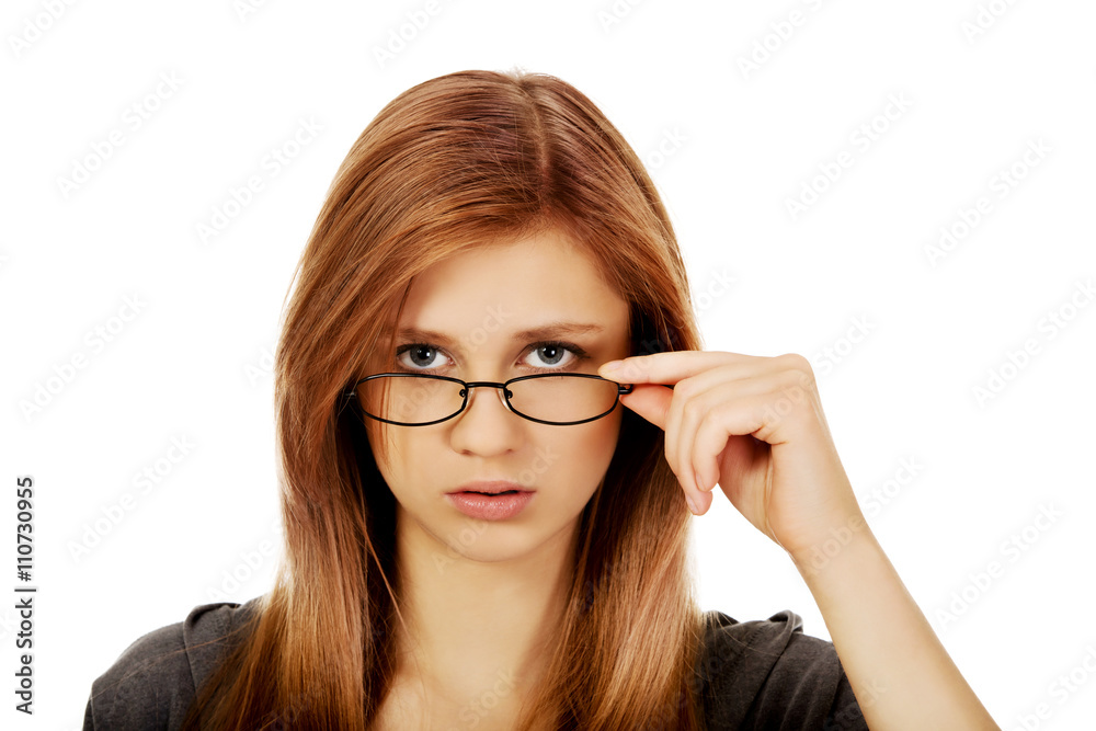Pretty teenage woman improving glasses Pretty teenage woman improving glasses