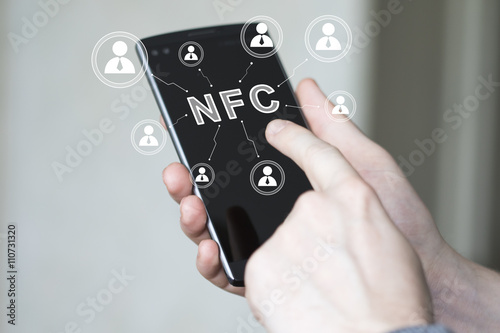Businessman pressing button NFC communication phone