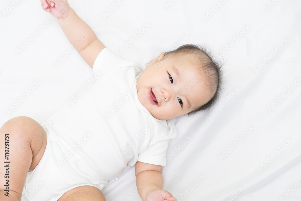 Portrait of a newborn Asian baby on the bed Portrait of a newborn Asian baby on the bed