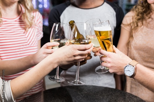 Konstfotografi Group of friends toasting with beer and wine