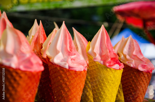 Multi-colored waffle cones with cream