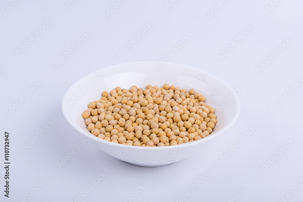 Soybeans in a white bowl isolated on white background. Soybeans in a white bowl isolated on white background.