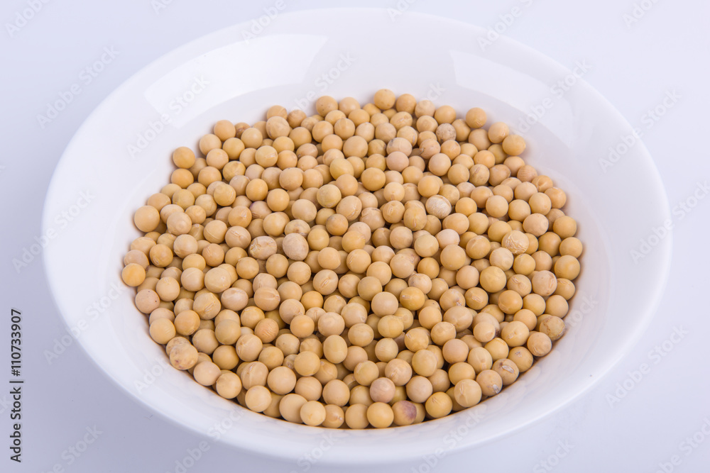 Soybeans in a white bowl isolated on white background. Soybeans in a white bowl isolated on white background.