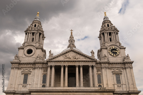 The west front upper part of St Paul's Cathedral which sits at the highest point of the City of London, UK on the cloudy sky day. The most famous public place for tourist.