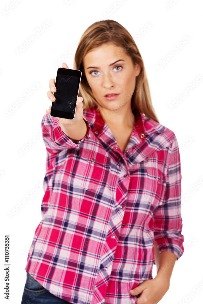 Young woman shows broken mobile phone Young woman shows broken mobile phone