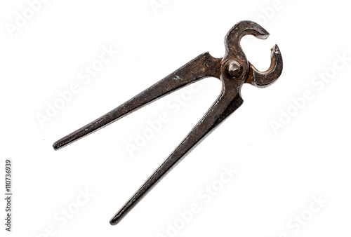 Old iron cutting pliers, tongs or nippers isolated on white.