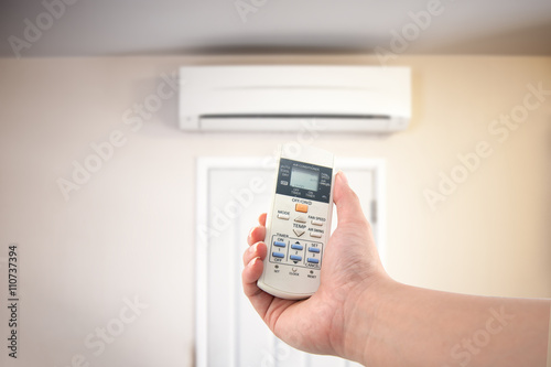 Closeup view about using some appliance such as air condition.