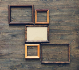 frames on wooden wall