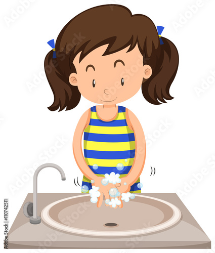 Girl washing hands in the sink