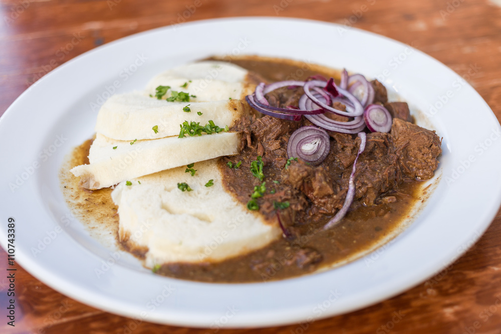 Beef Goulash and Bread Dumplings serving Beef Goulash and Bread Dumplings serving