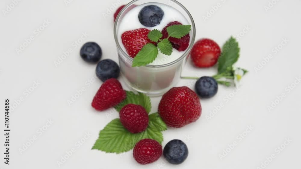 Natural yogurt with fresh berries and mint leaves isolated on withe
and daylight Natural yogurt with fresh berries and mint leaves isolated on withe
and daylight