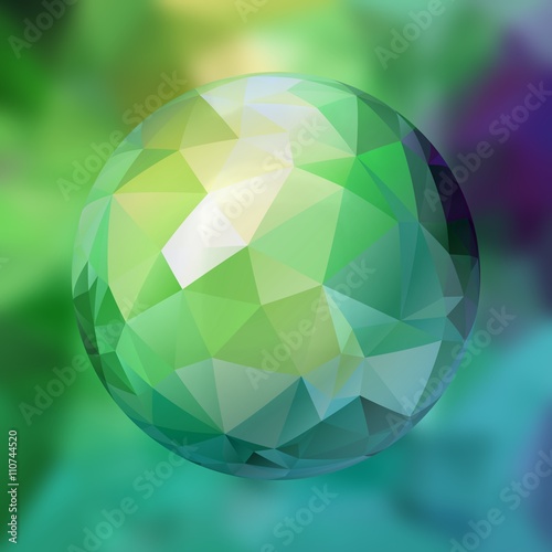 glass sphere with polygon pattern on blurred background - blue and green colored