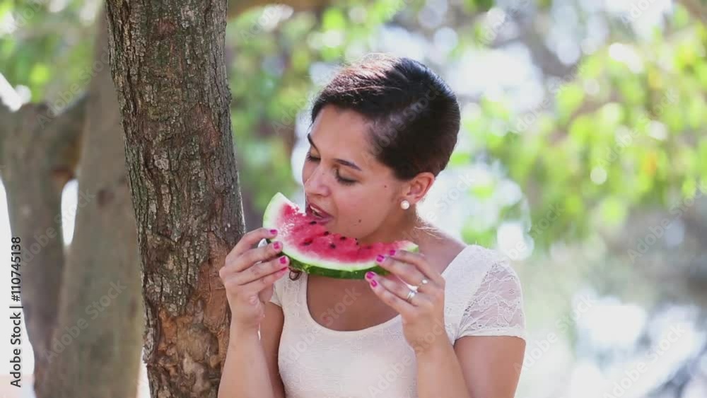Woman eating watermelon