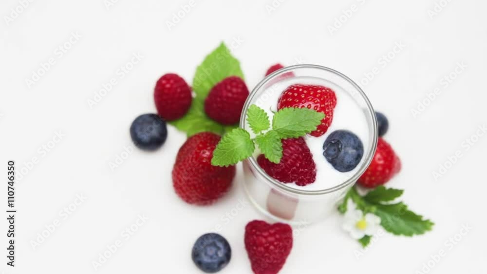 Natural yogurt with fresh berries and mint leaves isolated on withe
and daylight Natural yogurt with fresh berries and mint leaves isolated on withe
and daylight