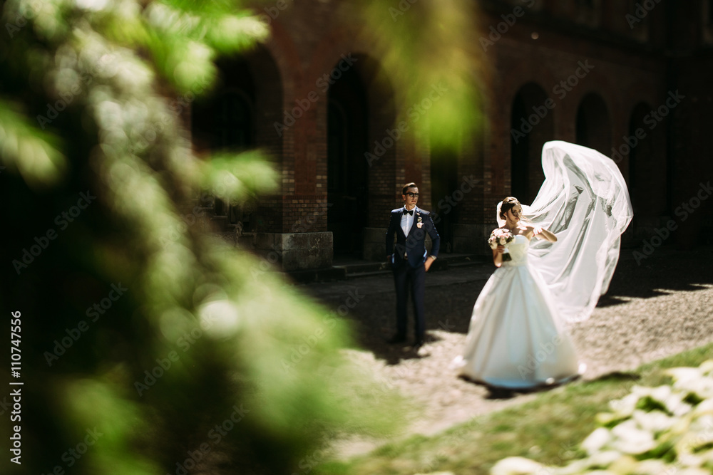 Modern young couple and the arches behind Modern young couple and the arches behind