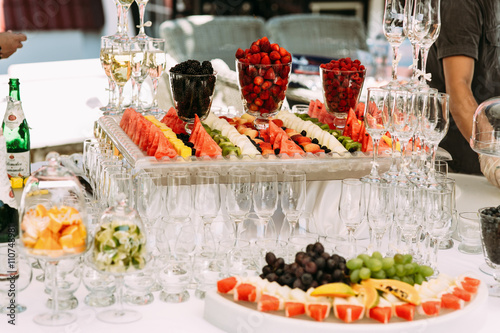 Sliced colorful fruits on the wedding table
