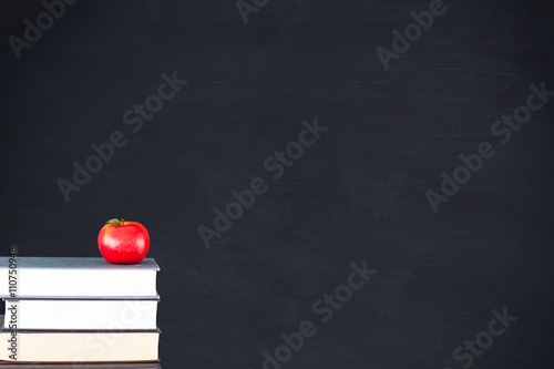 Composite image of books with apple