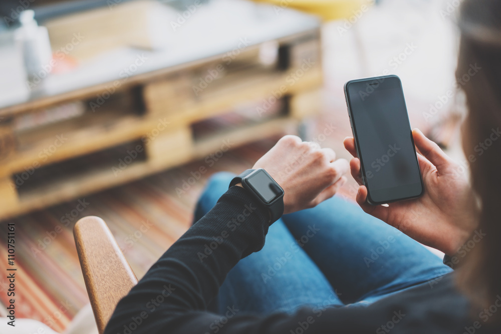 Picture Girl in Modern Studio Loft,Wearing Generic Design Smart Watch.Woman Using Synchronization Mobile Phone and watch. Manage Work Timeline Process. Horizontal mockup.Burred background. Film effect Picture Girl in Modern Studio Loft,Wearing Generic Design Smart Watch.Woman Using Synchronization Mobile Phone and watch. Manage Work Timeline Process. Horizontal mockup.Burred background. Film effect