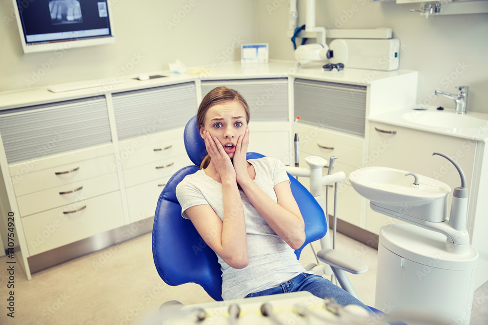 scared and terrified patient girl at dental clinic scared and terrified patient girl at dental clinic