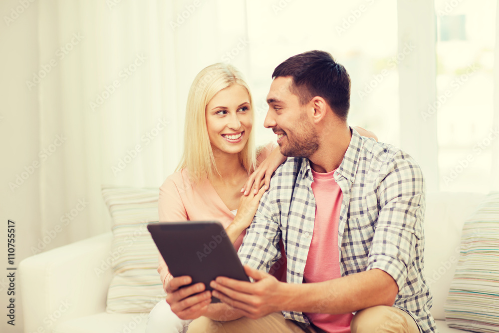 smiling happy couple with tablet pc at home smiling happy couple with tablet pc at home