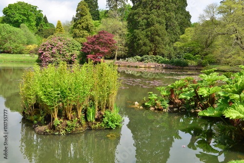 An English country garden with a lake in late springtime.