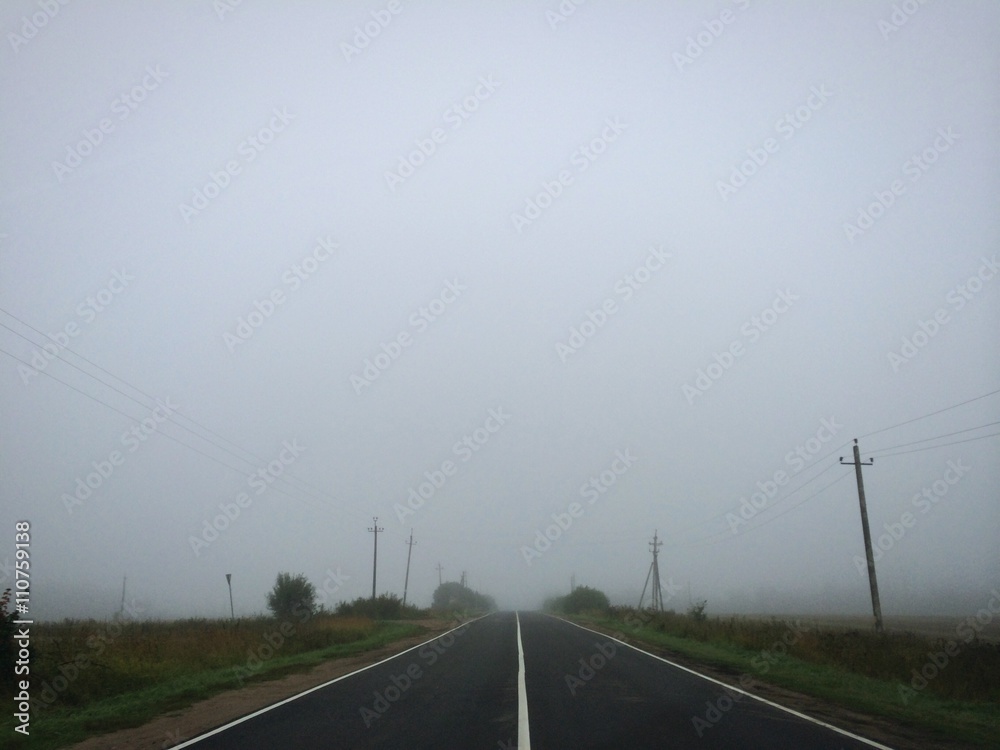Fototapeta premium Empty foggy asphalt road