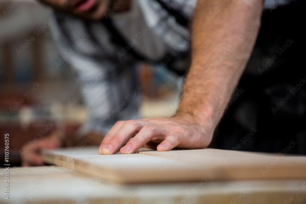 Carpenter working on his craft