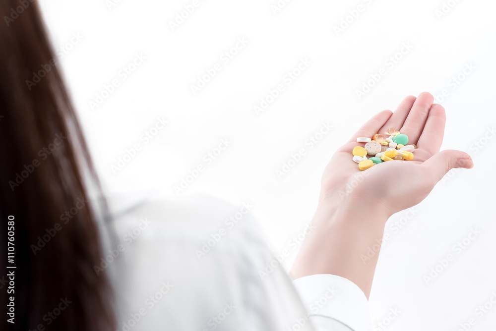 pills in the hand of a doctor.