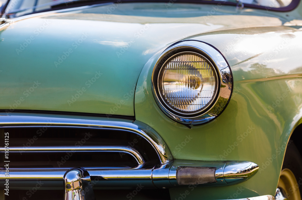 Close-up detail of vintage car. Headlight of retro car. Selective focus.