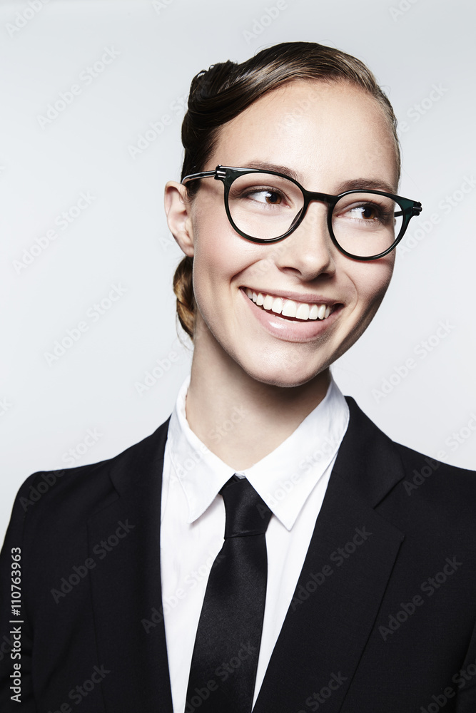 Beautiful businesswoman in spectacles, smiling