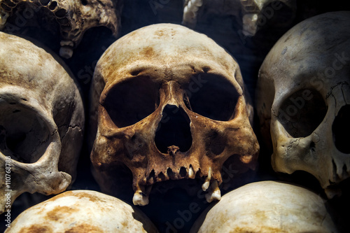 Human skulls at the Killing Fields of Choeung Ek, Phnom Penh, Cambodia.