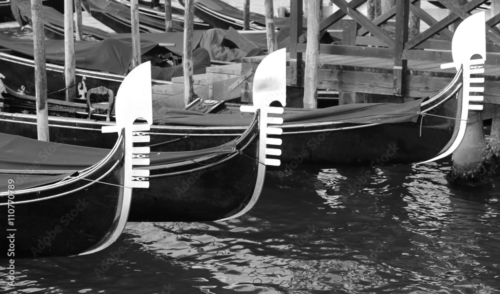 three prows of Venetian gondolas
