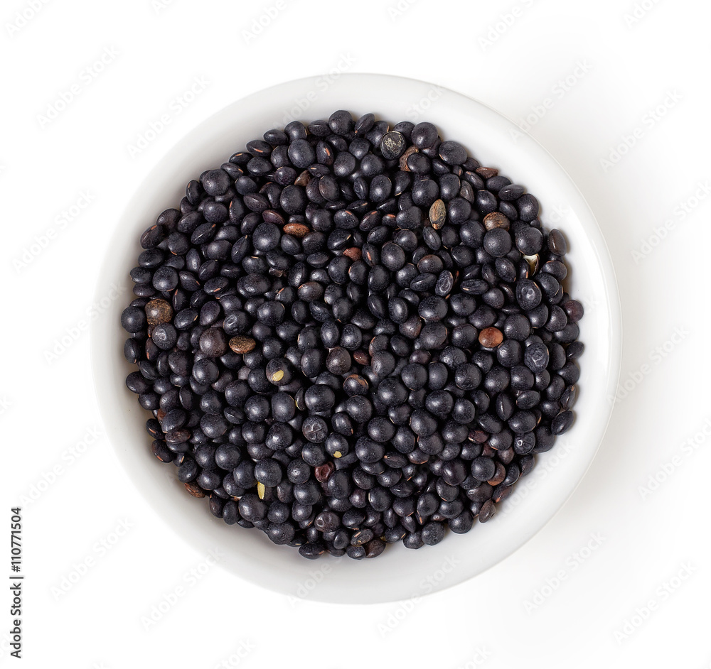 Bowl of Beluga lentil isolated on white, from above Bowl of Beluga lentil isolated on white, from above