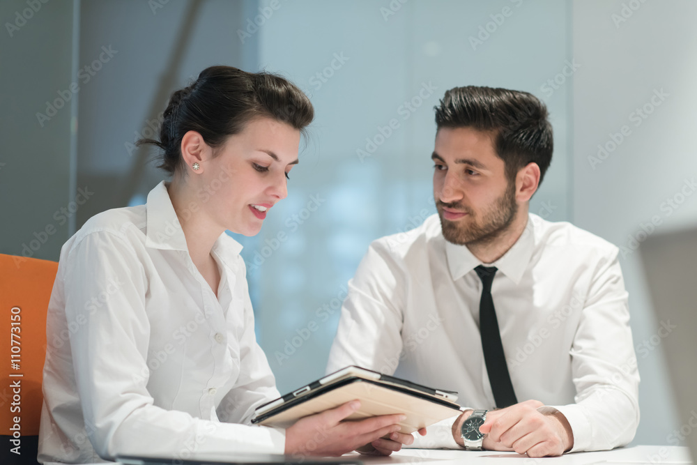 young business couple working together on project young business couple working together on project