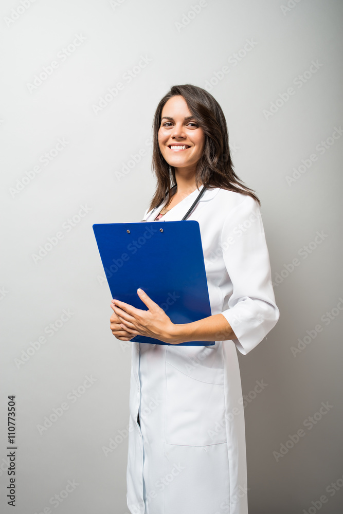Woman doctor holding a document Woman doctor holding a document