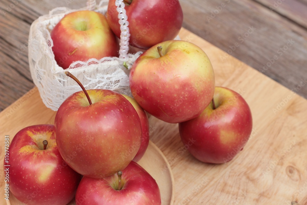 red apples is delicious on wood background. red apples is delicious on wood background.