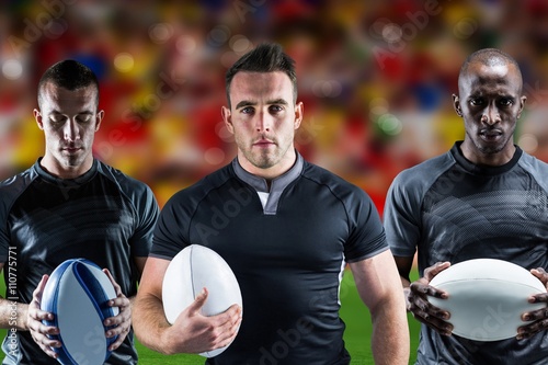 Composite image of rugby player posing face to the camera