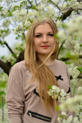 Beautiful,cute,nice,blonde,happy,smiling,joyful,young,attractive,healthy girl,model in the blossoming,white garden,outdoors.Spring.Portrait.Fresh.Natural.Luxurious.Cherry.Day.Landscape.Springtime,nice